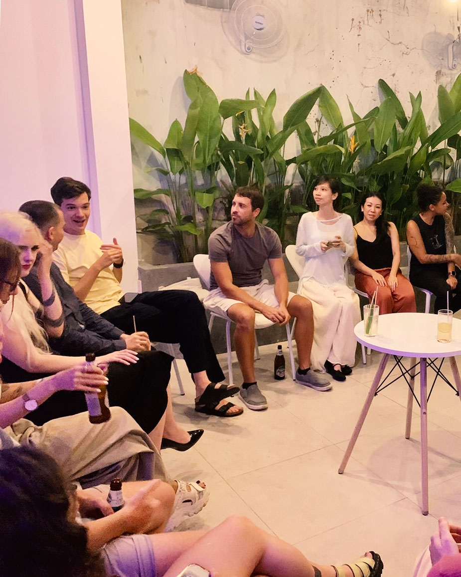 Small group seated in courtyard