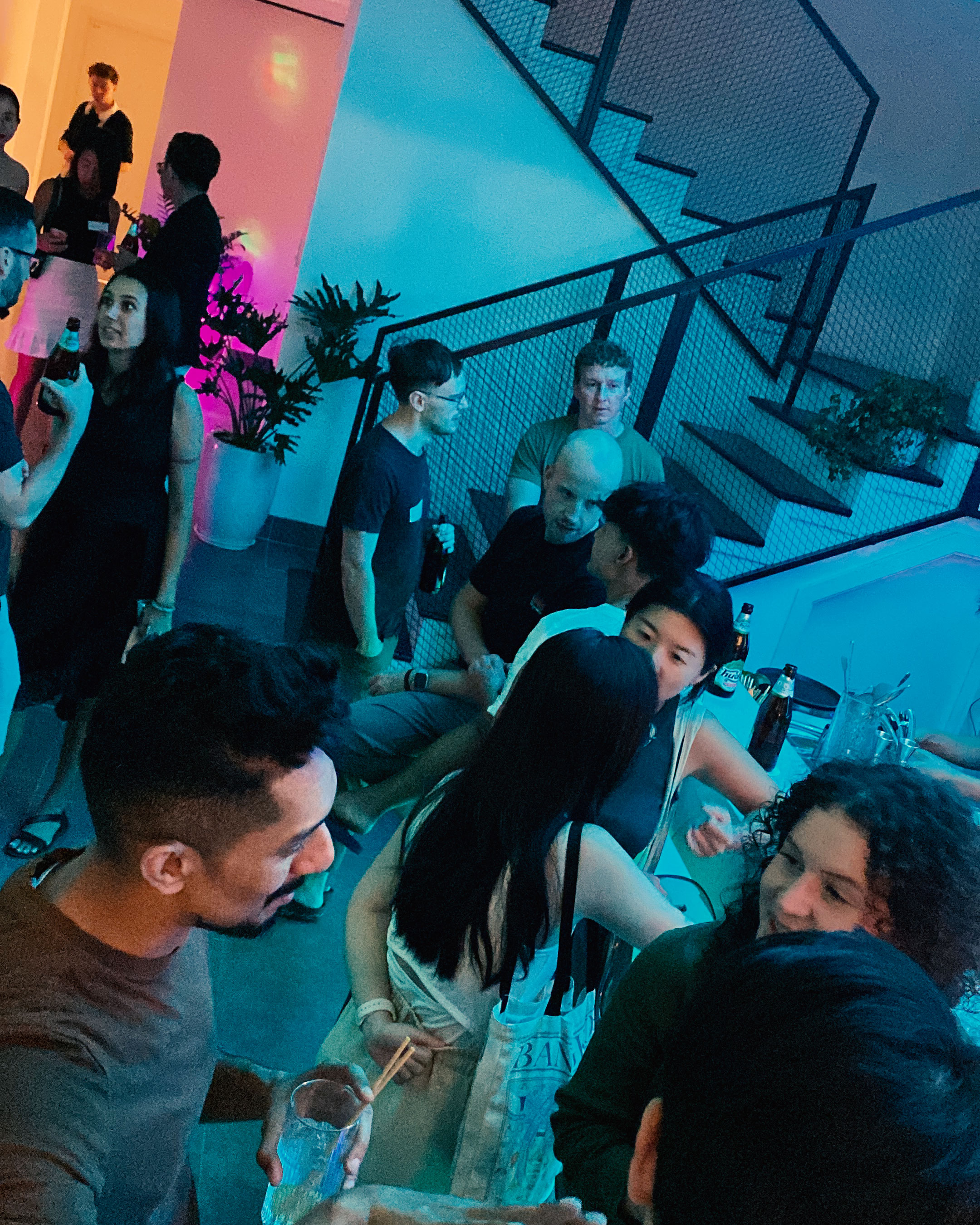 Social gathering by bar and staircase